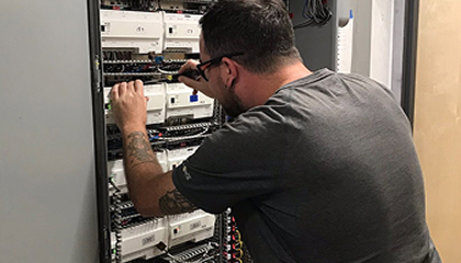 HVAC technician working on equipment
